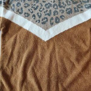 It's a pretty stylish sweater. Super conformable, fuzzy, cute for any occasion